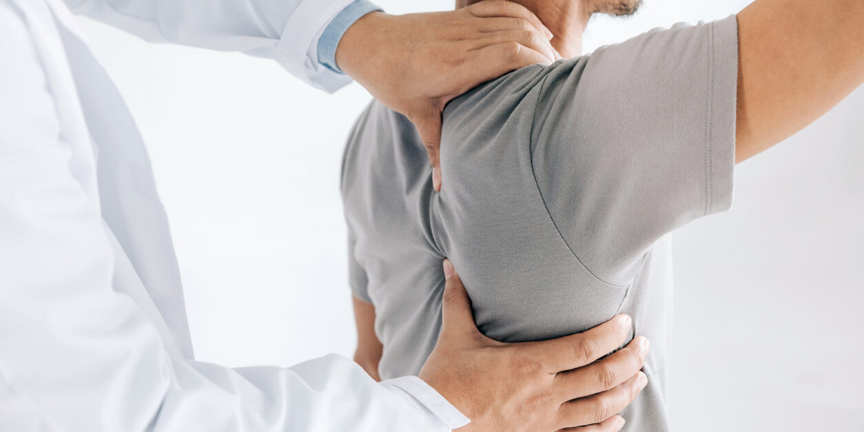 Chiropractor Performing Adjustment on Patient's Back
