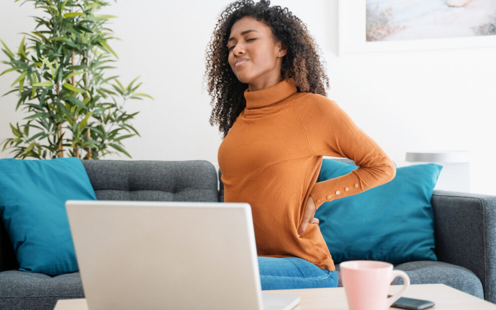 Woman Working on Computer with Back Pain