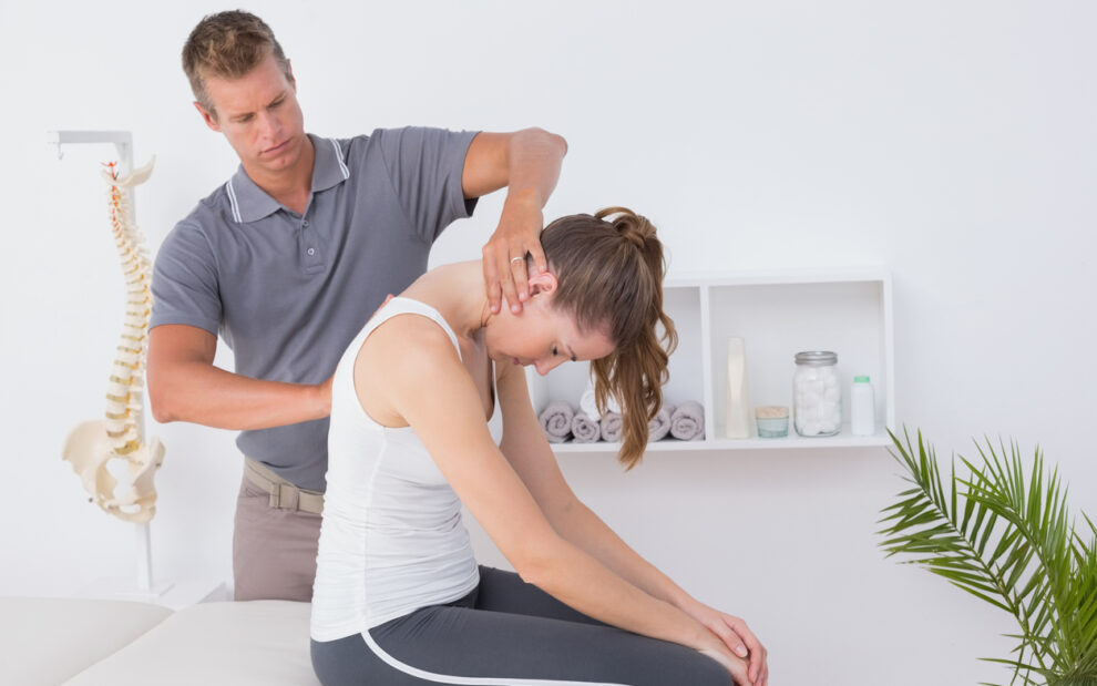 chiropractor doing neck adjustment